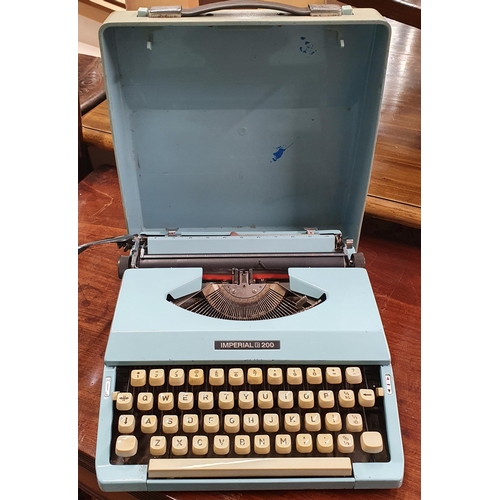 109 - Three 20th Century Wall Clocks along with an Imperial Typewriter.