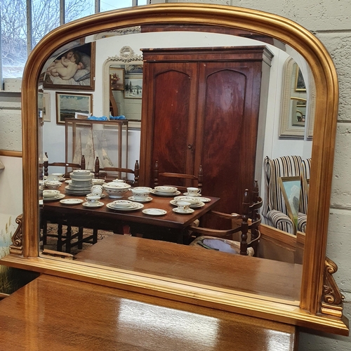 90 - A 20th Century timber gilt archtop Mirror with bevelled glass.
Height 82 x W 105 cm approx.