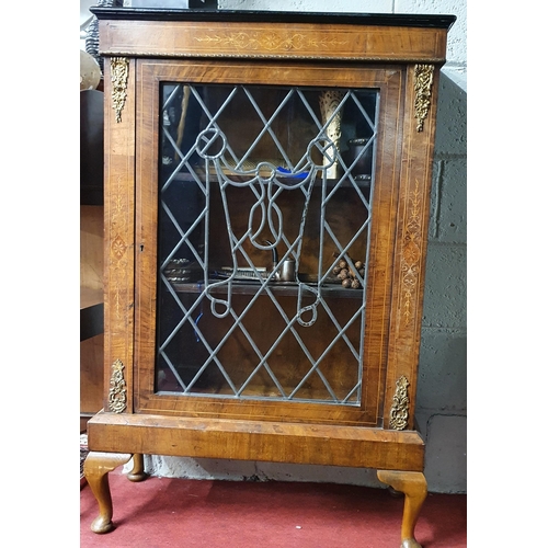 198 - A 19th Century Walnut and Inlaid single door Side Cabinet with leaded panel glass front and ormolu m... 