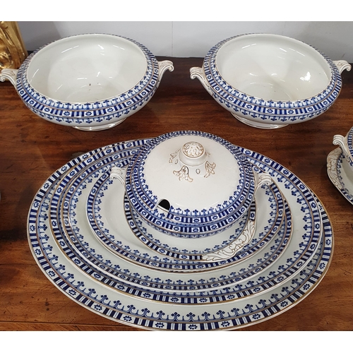 406 - A Luxor part dinner service white with blue geometric design.