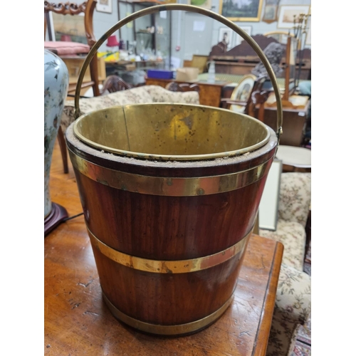 243 - A 19th Century Irish small Peat Bucket with brass liner. D 29 x H 30 cm approx.