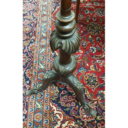 261 - A very unusual 19th Century adjustable Standard Lamp with highly carved shaft and base.