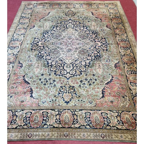 297 - A very large Vintage Iranian design Carpet with unique colours of cream and pink ground and a large ... 