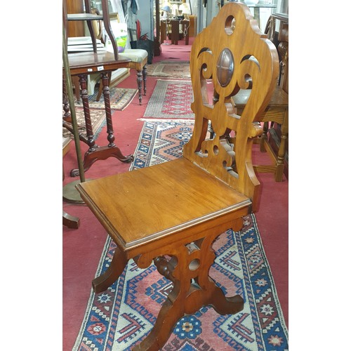 1042 - A really good pair of 19th Century Mahogany Hall Chairs with a highly carved stretcher base and pier... 