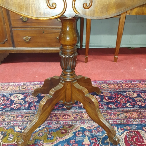 726 - A Victorian Mahogany Tea Table with a serpentine fold-over top and sabre legs. Circa 1860. 
H 76 x L... 