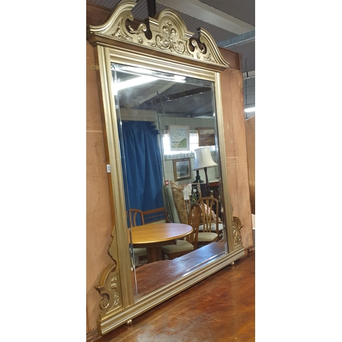 694 - A late 19th early 20th Century Timber and Gilt Overmantel Mirror with architectural pediment top and... 