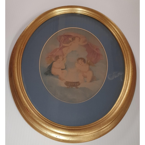 533 - A well framed pair of 19th Century oval coloured Prints of cherubs. 39 x 33 cm approx.