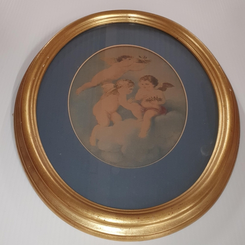 533 - A well framed pair of 19th Century oval coloured Prints of cherubs. 39 x 33 cm approx.