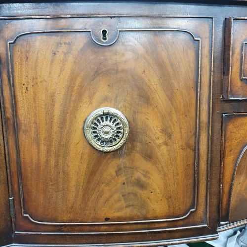 547 - A good late 19th Century bow fronted Sideboard with twin doors flanking central drawers on square ta... 