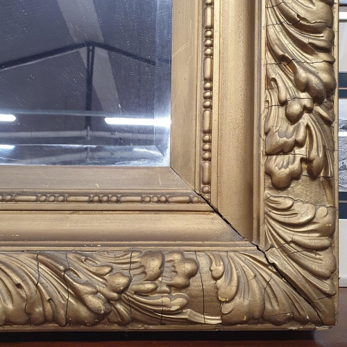 552 - An extremely heavy Timer Gilt rectangular Mirror with bevelled glass. 126 x 109 cm approx.