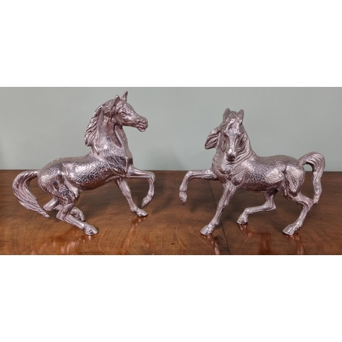 1024 - A pair of Silver plated rearing Horses.