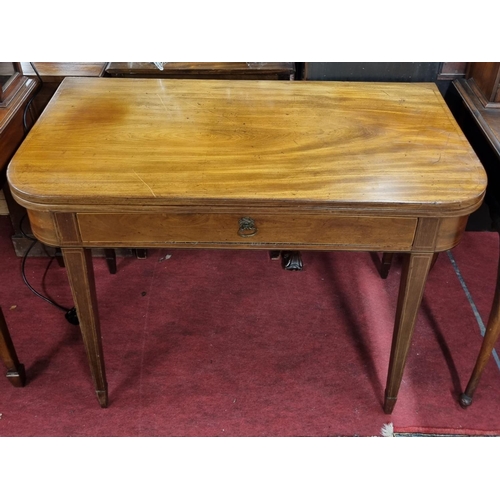 1030 - A good Regency Mahogany fold over tea Table with single drawer freeze.