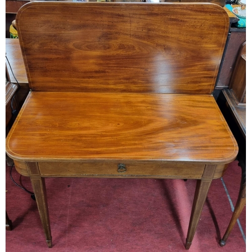 1030 - A good Regency Mahogany fold over tea Table with single drawer freeze.