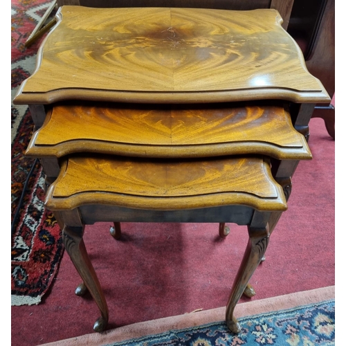 1050a - A good 20 Century Mahogany nest of three Tables with serpentine outline.