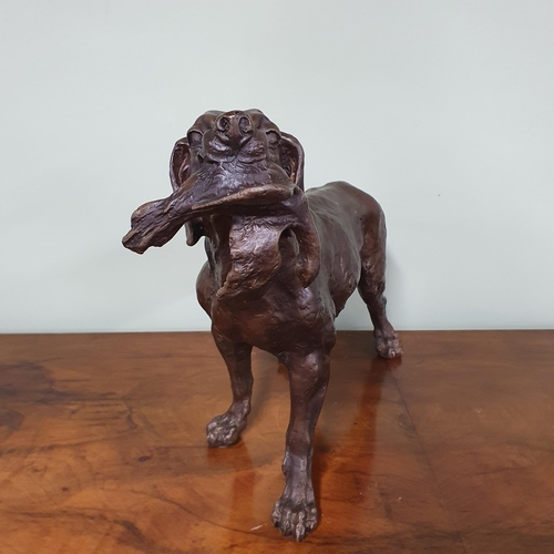 839 - A Bronze figure hunting dog. Dimensions (H x W x D) approx. 29x45x13cm