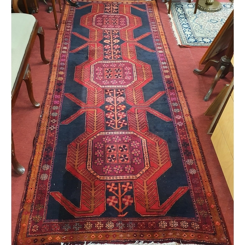 1036 - A deep ground Persian Nahavand Runner with a unique medallion design and colours.
297 x 113 cm appro... 