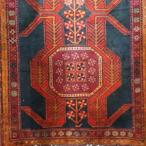 1036 - A deep ground Persian Nahavand Runner with a unique medallion design and colours.
297 x 113 cm appro... 