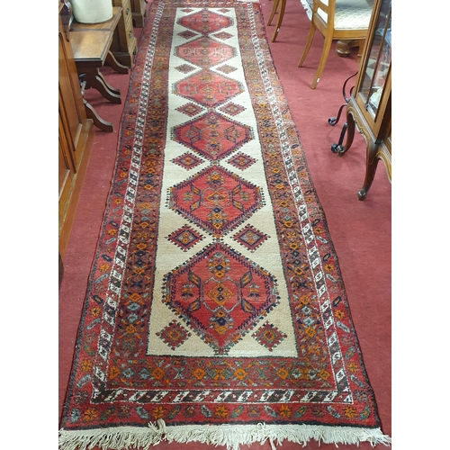 1048 - A Cream ground Persian Miskin Runner with a traditional Miskin diamond design.
430 x 115 cm approx.