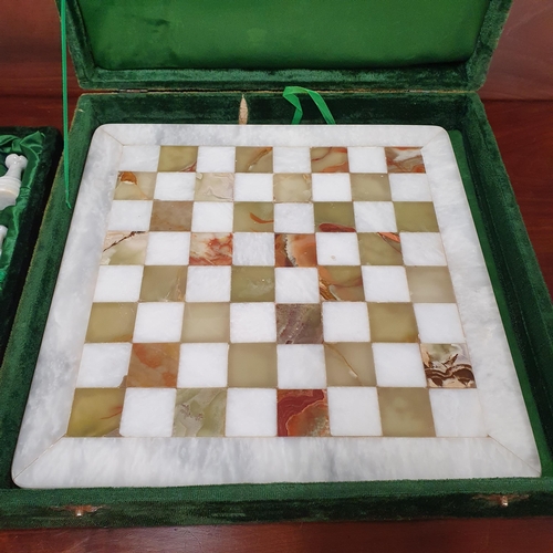 1197 - A Fine Quality '' Onyx'' Marble Chess set Enclosed in a Green Velvet Box .