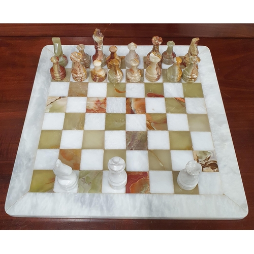 1197 - A Fine Quality '' Onyx'' Marble Chess set Enclosed in a Green Velvet Box .