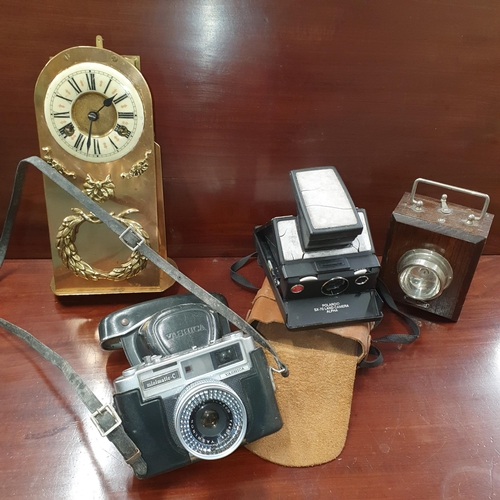 154 - An early Polaroid FX70 land Camera along with  a Yashica Matic Camera in case, a vintage light and a... 