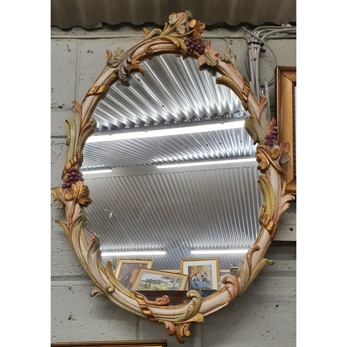 186 - A good hand painted oval Mirror with grapes on vines, with highly carved decoration.
Height 88 x W 5... 