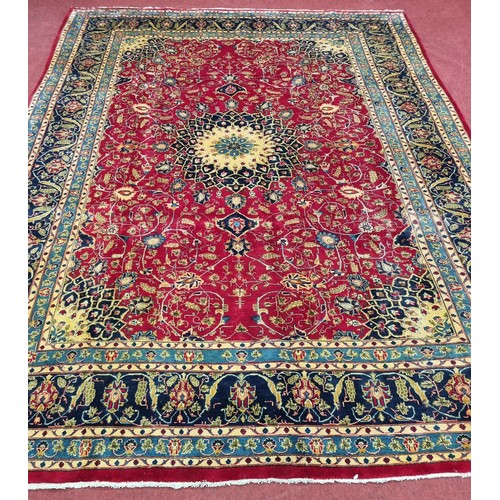 212 - A large red ground Persian Marshad Carpet with a Lozenge and medallion Shah Saffy design. 390 x 290 ... 