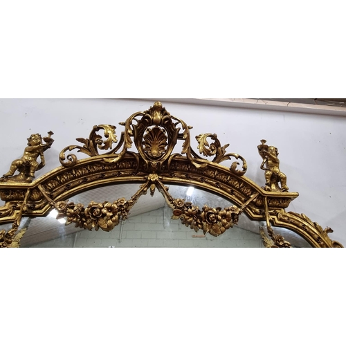 257 - A fabulous Timber and plaster Gilt overmantel Mirror with a highly molded outline, highly molded ped... 