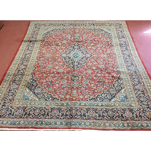 253 - A rich Red ground Persian Kashan Carpet with traditional Kashan medallion design. 380 x 292cm approx... 