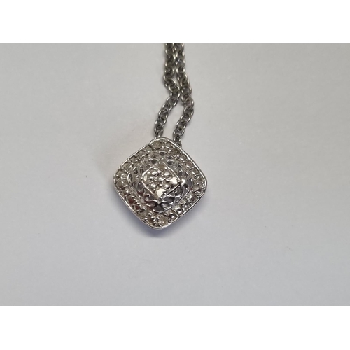 322 - A Silver and Diamond Pendant with Necklace.