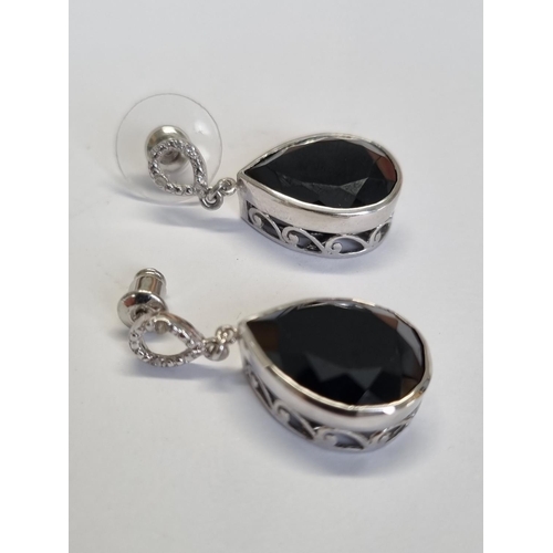 317 - A pair of gem set Silver Earrings.