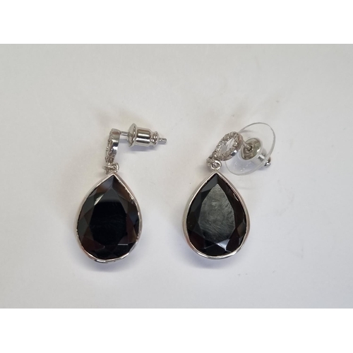 317 - A pair of gem set Silver Earrings.