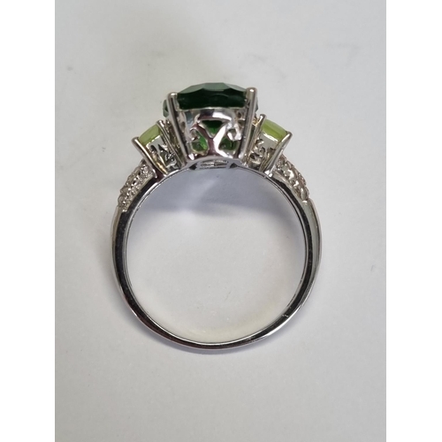 314 - A Silver and Gem set Ring, size R.