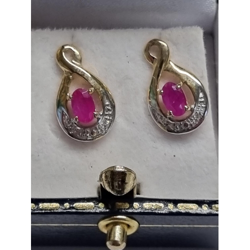 380 - A pair of Gold, Diamond and Ruby Earrings.