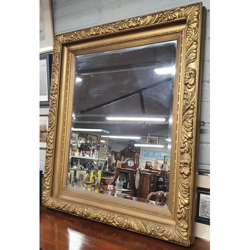 34 - An extremely heavy Timber Gilt rectangular Mirror with bevelled glass. 126 x 109 cm approx.