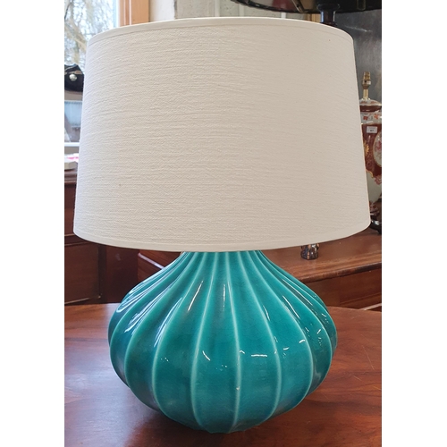 47 - A turquoise coloured bulbous Table Lamp. H 28 cm approx.