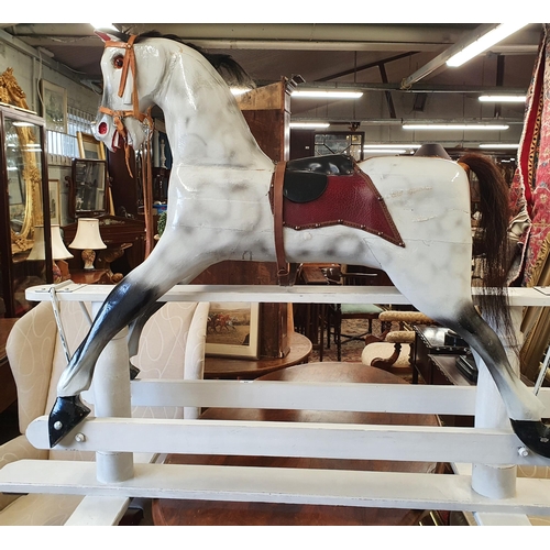 55 - An early 20th Century good hand painted Timber Rocking horse. W 153 x H 113cms approx.