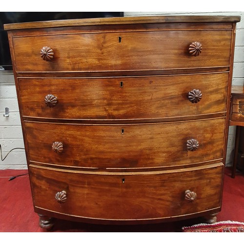 14 - A good 19th Century mahogany and crossbanded bowfront chest of four long drawers, with gadrooned kno... 