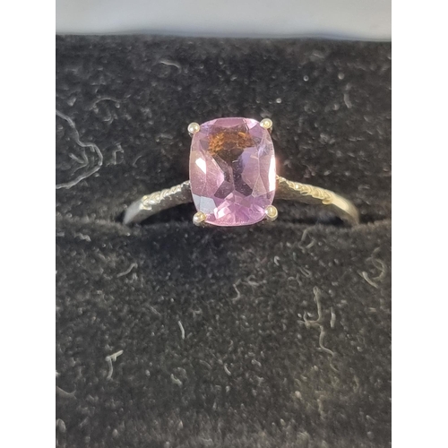 121 - A Silver and Gem Ring, size S.