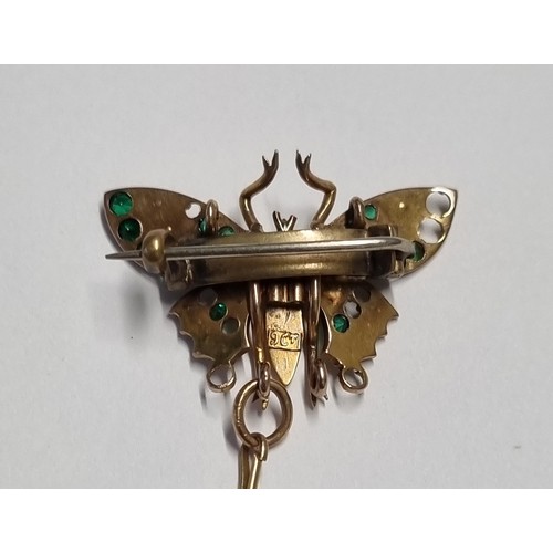 125A - A very nice 9ct Gold Broach with Emeralds and Pearls and a Ruby centre ( some stones missing).