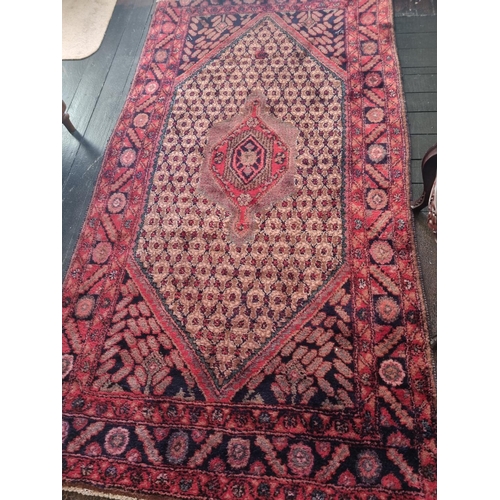 766 - A Persian Hamadan village Rug with a Culia design. 137 x 242 cm approx.