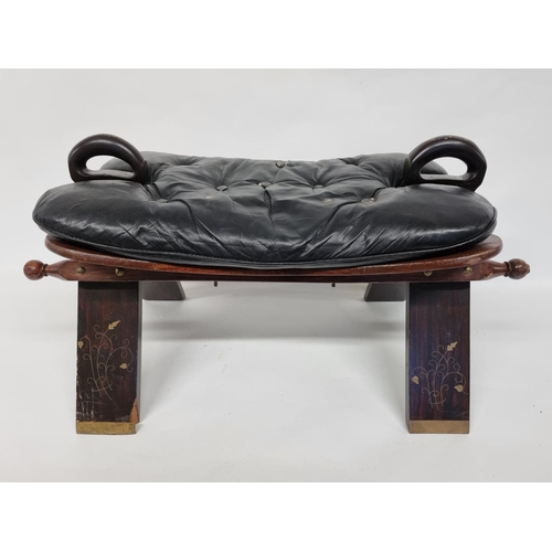 768 - A good Hardwood camel Stool with black Leather deep buttoned top. 74 x 39 x H 40 cm approx.