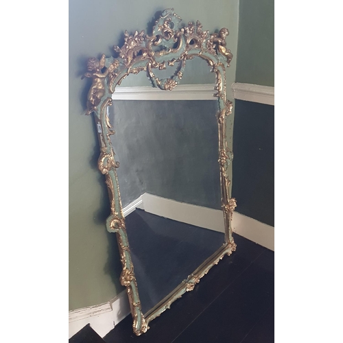 771 - A Spectacular pair of Gilt and hand painted Mirrors with cherub outline profusely moulded mirror gla... 