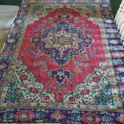 772 - A washed Red and Blue ground Persian Tabriz Carpet with bespoke central medallion design. 187 x 252 ... 