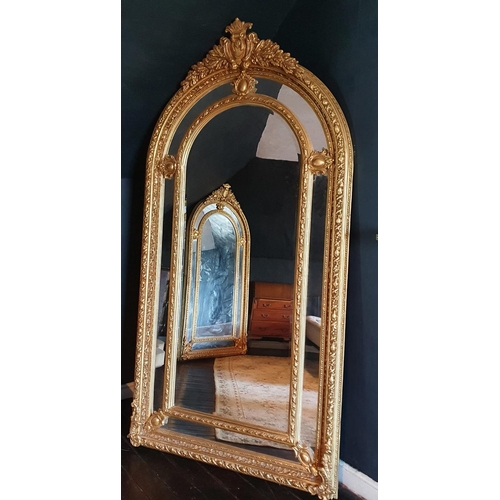 776 - A Fabulous Timber Gilt and Plaster Gilt fashion Mirror with highly carved outline and cartouche pedi... 