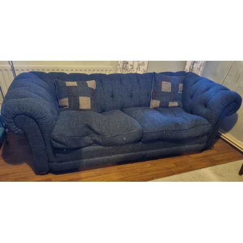 845 - A large three seater Chesterfield Sofa with herring bone wool design upholstery. W 205 x 90 x SH 40 ... 