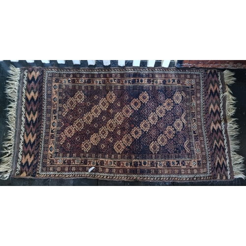 851 - A small Persian Rug.