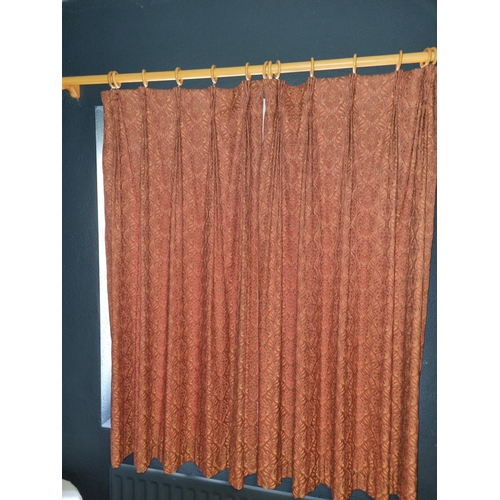 852 - A pair of Rust ground Curtains 138 drop x 59 each curtain.