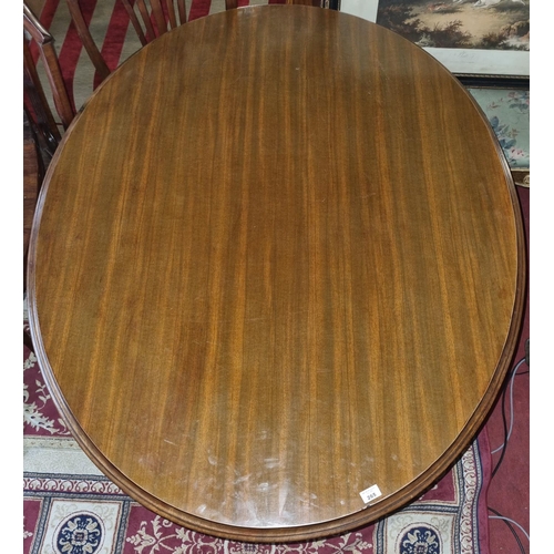 6 - A large 19th Century Mahogany oval supper Table with molded edge on quatrefoil base.
H 72 x D 107 W ... 
