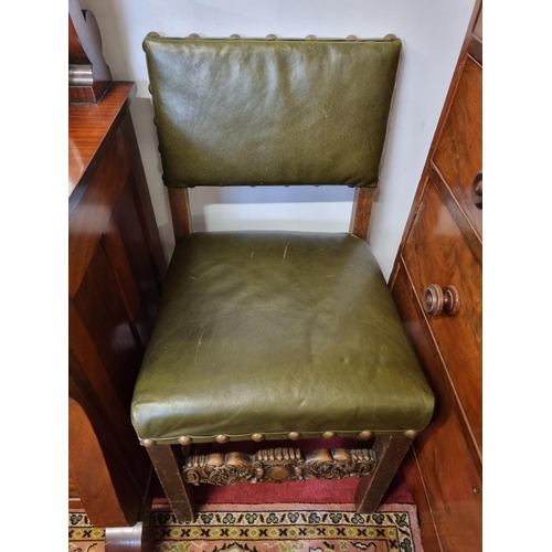 20 - An early 20th Century Oak Chair with a fully upholstered Green leather and studded seat and back. H ... 